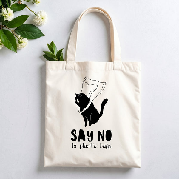 Plovera Co Say No to Plastic Bags tote laid flat on pale grey with white blossom and green leaves