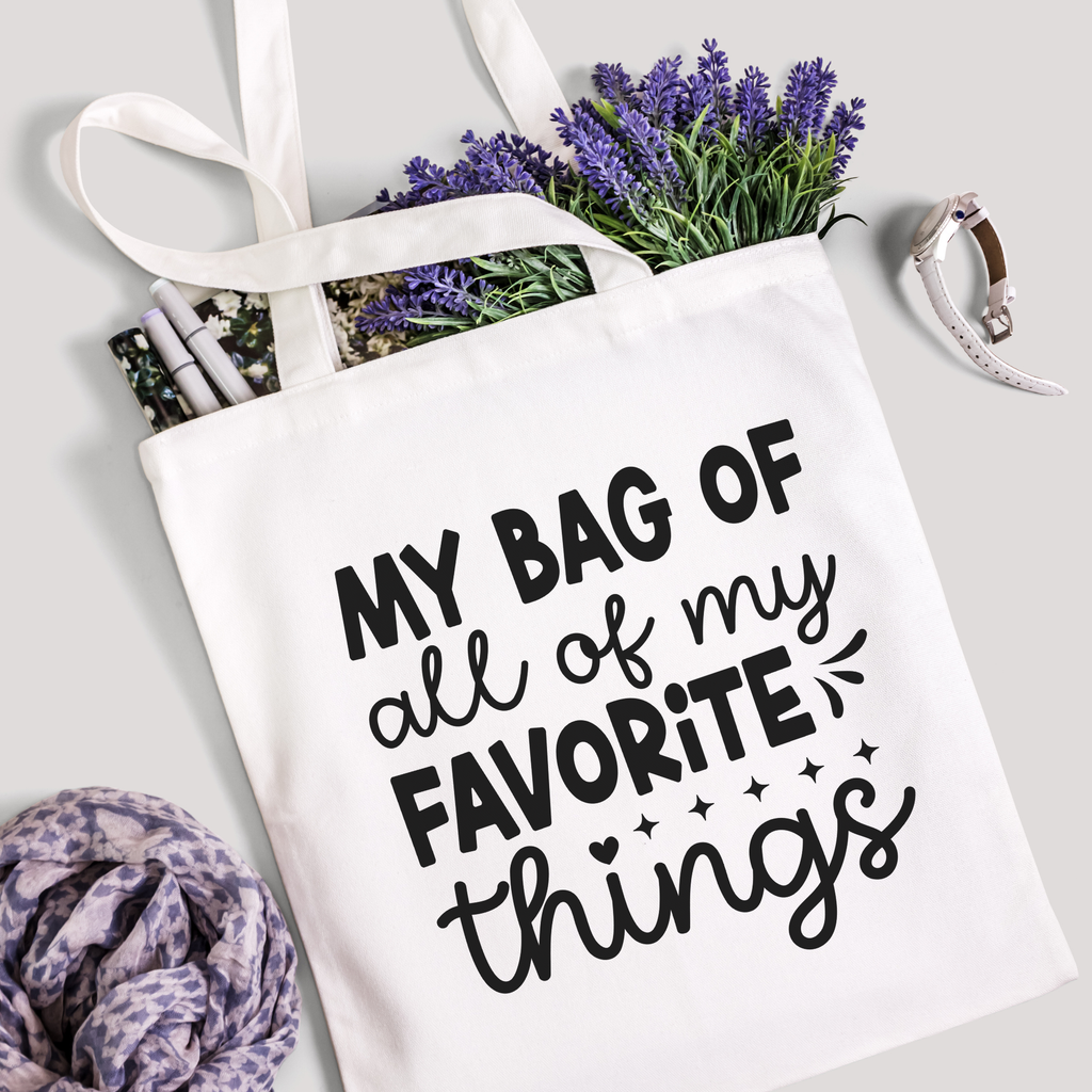 Favorite Things tote filled with lavender stems and marker pens, leopard-print scarf below