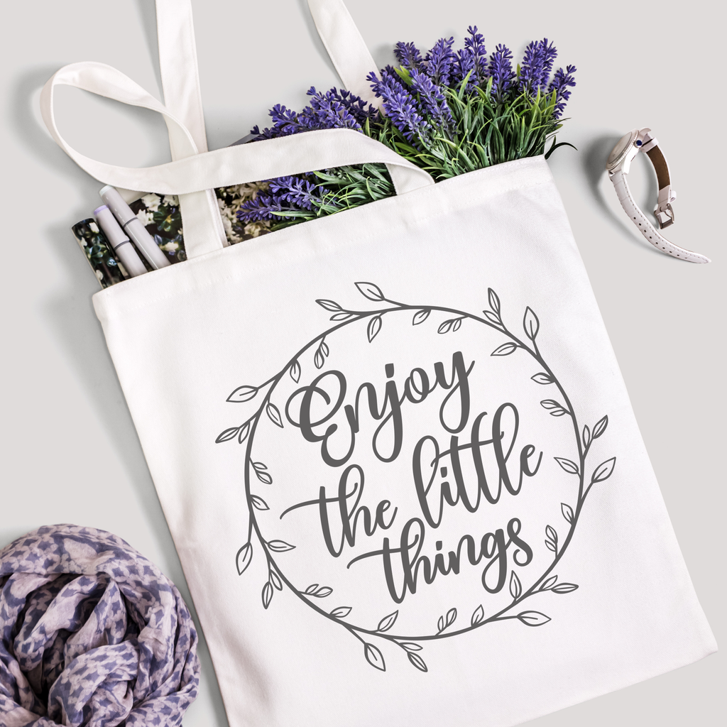 Enjoy the Little Things tote filled with lavender stems and marker pens, leopard-print scarf below