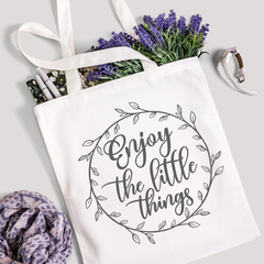 Enjoy the Little Things tote filled with lavender stems and marker pens, leopard-print scarf below