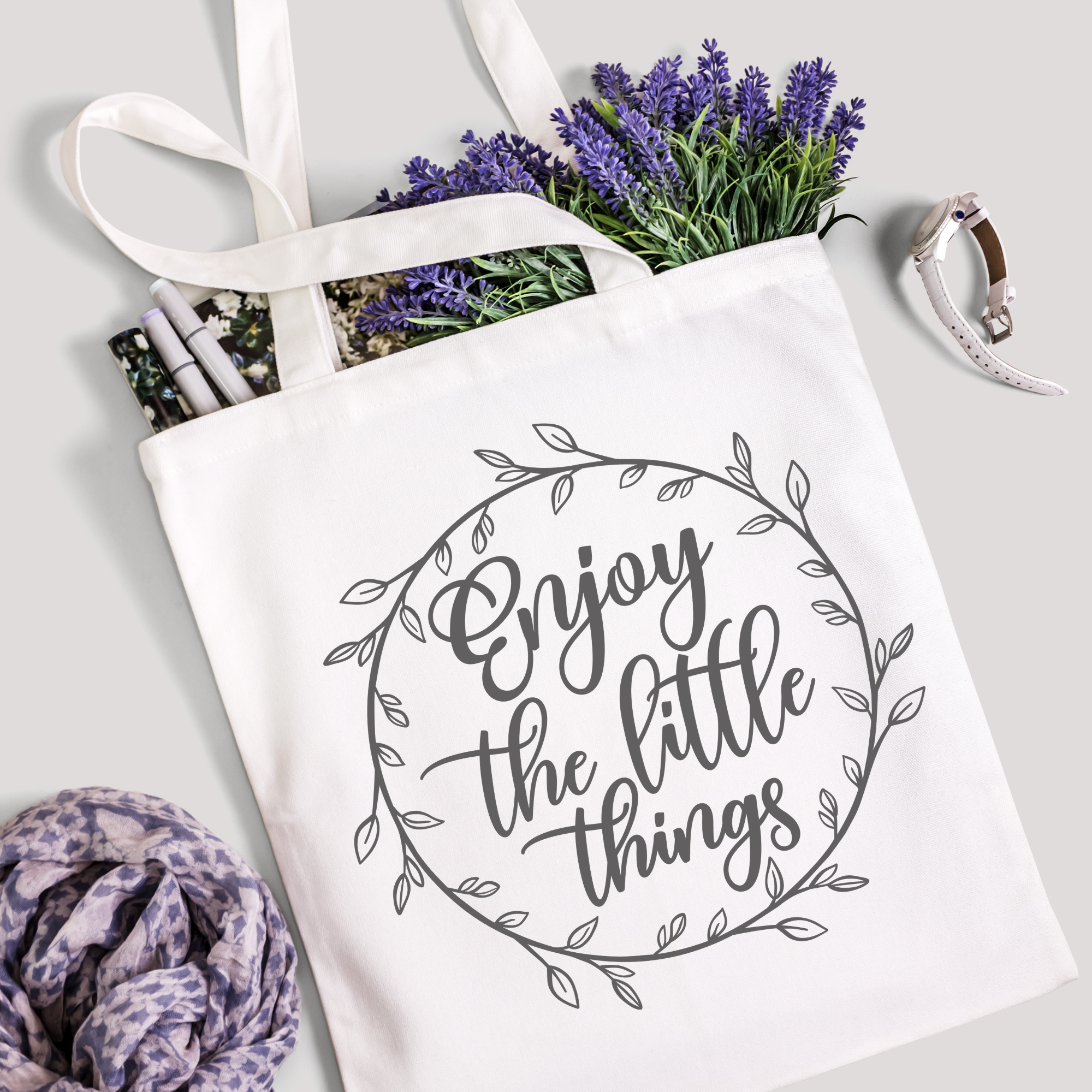 Enjoy the Little Things tote filled with lavender stems and marker pens, leopard-print scarf below