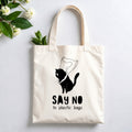 Plovera Co Say No to Plastic Bags tote laid flat on pale grey with white blossom and green leaves