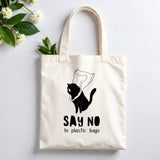 Plovera Co Say No to Plastic Bags tote laid flat on pale grey with white blossom and green leaves