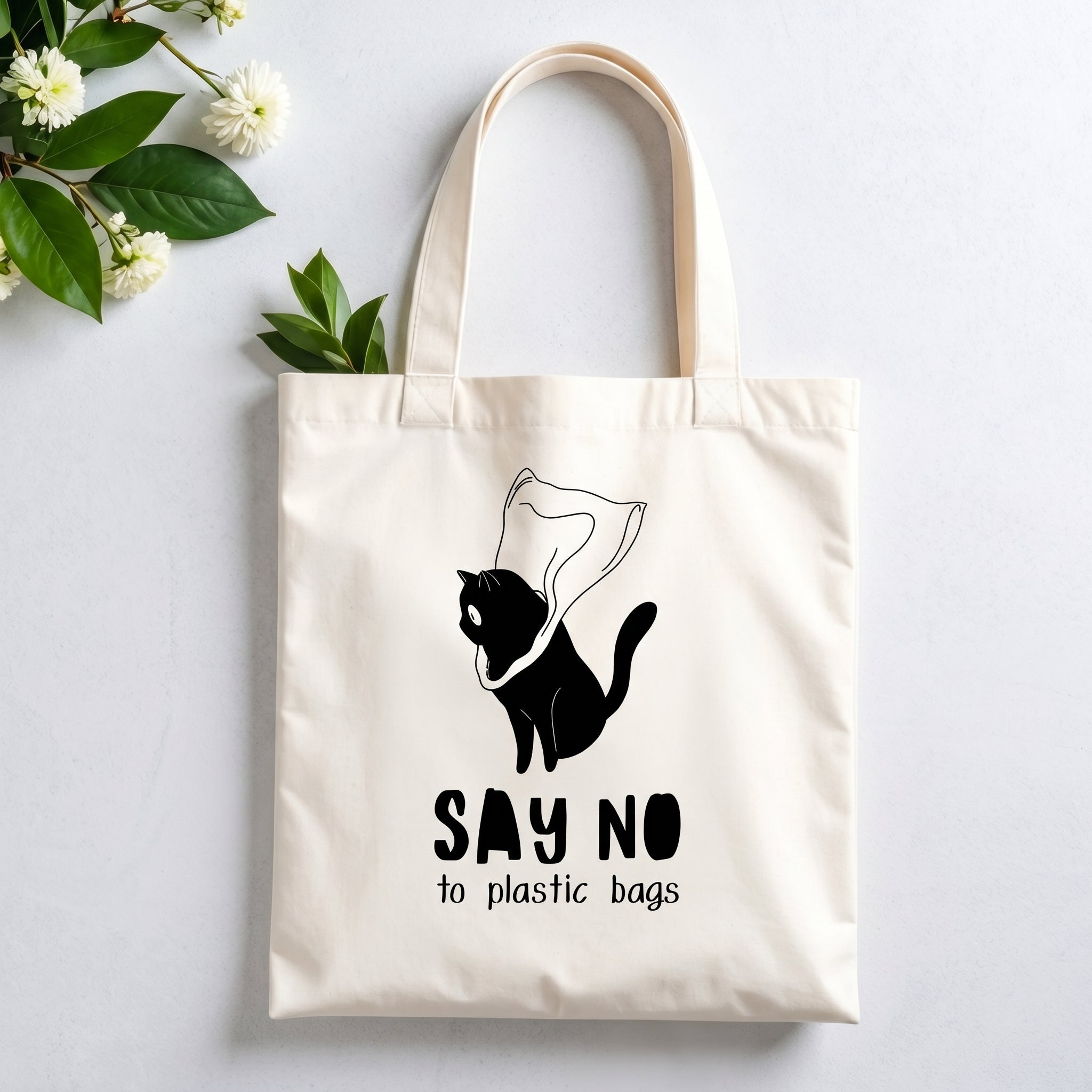 Plovera Co Say No to Plastic Bags tote laid flat on pale grey with white blossom and green leaves
