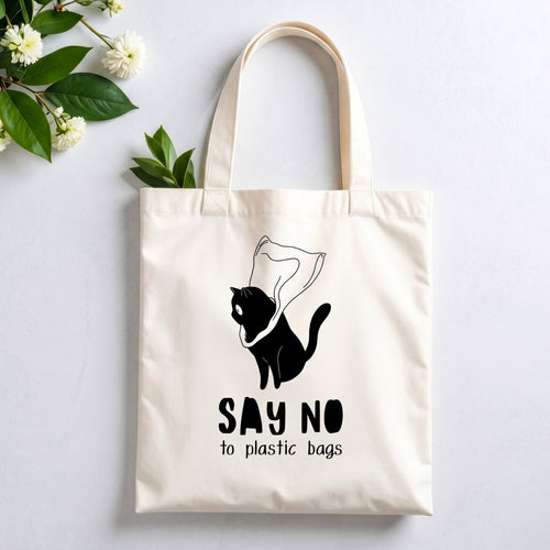 Plovera Co Say No to Plastic Bags tote laid flat on pale grey with white blossom and green leaves