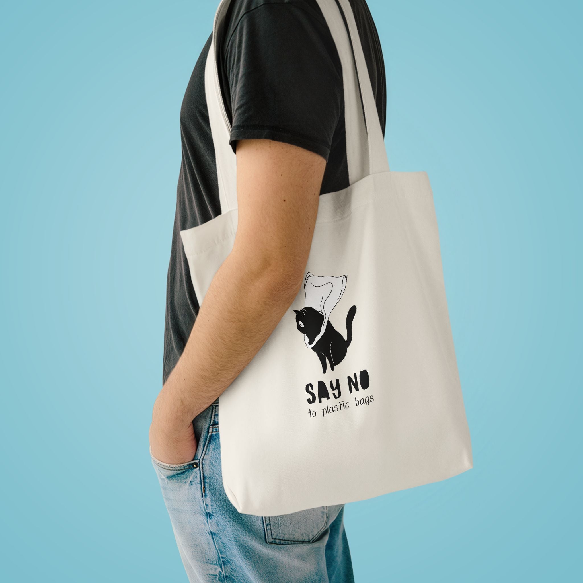 Say No to Plastic Bags tote over the shoulder of a person in a charcoal tee against pale blue