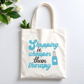 Plovera Co Shopping Is Cheaper Than Therapy tote laid flat with white blossom on pale grey