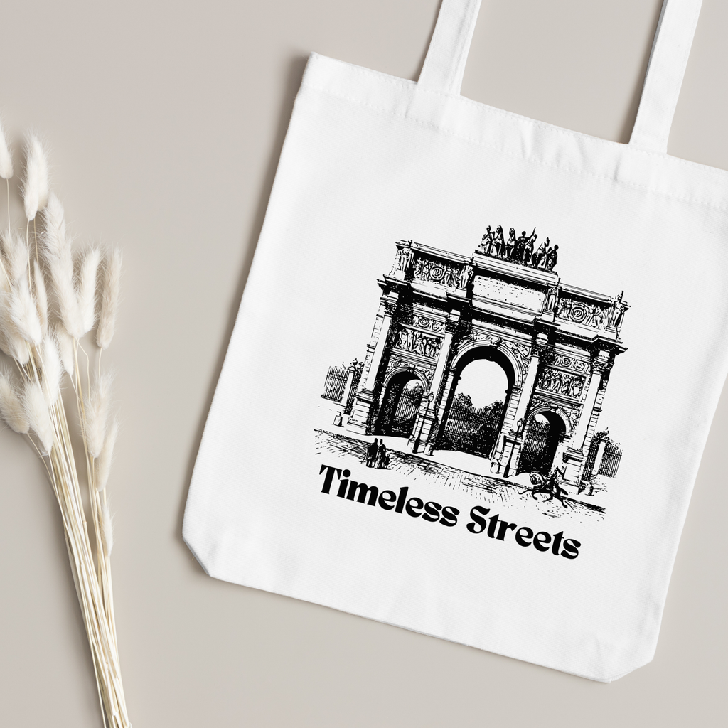 Inked triumphal arch illustration close up, dried bunny-tail grass on a taupe surface