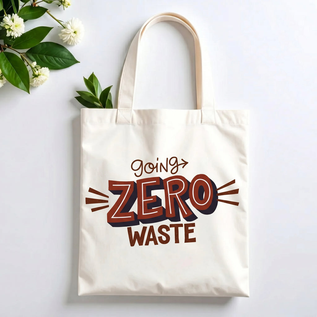 Plovera Co Going Zero Waste tote laid flat on pale grey with white blossom and green leaves