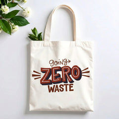 Plovera Co Going Zero Waste tote laid flat on pale grey with white blossom and green leaves