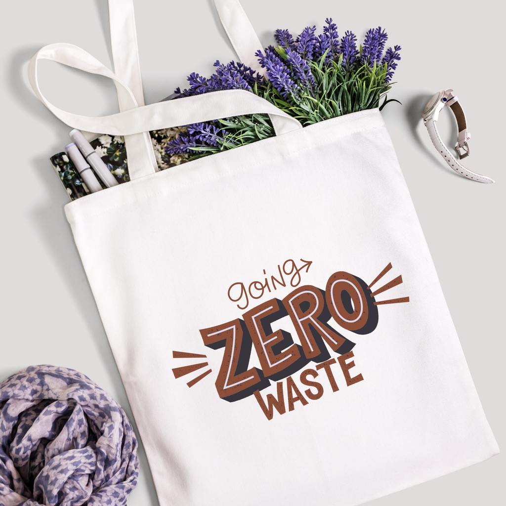 Going Zero Waste tote filled with lavender stems and marker pens, leopard-print scarf below
